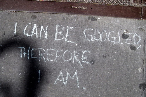 Chalk on sidewalk: "I can be Googled, therefore I am"