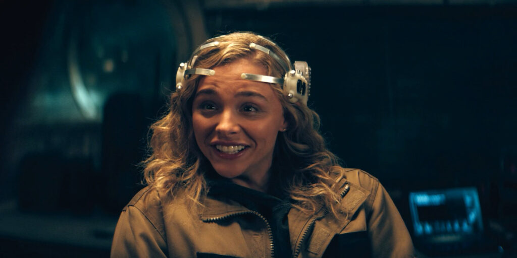 Chloë Grace Moretz as Flynne Fisher excited after using a futuristic VR headset with direct neural interface. As seen in The Peripheral (2022)